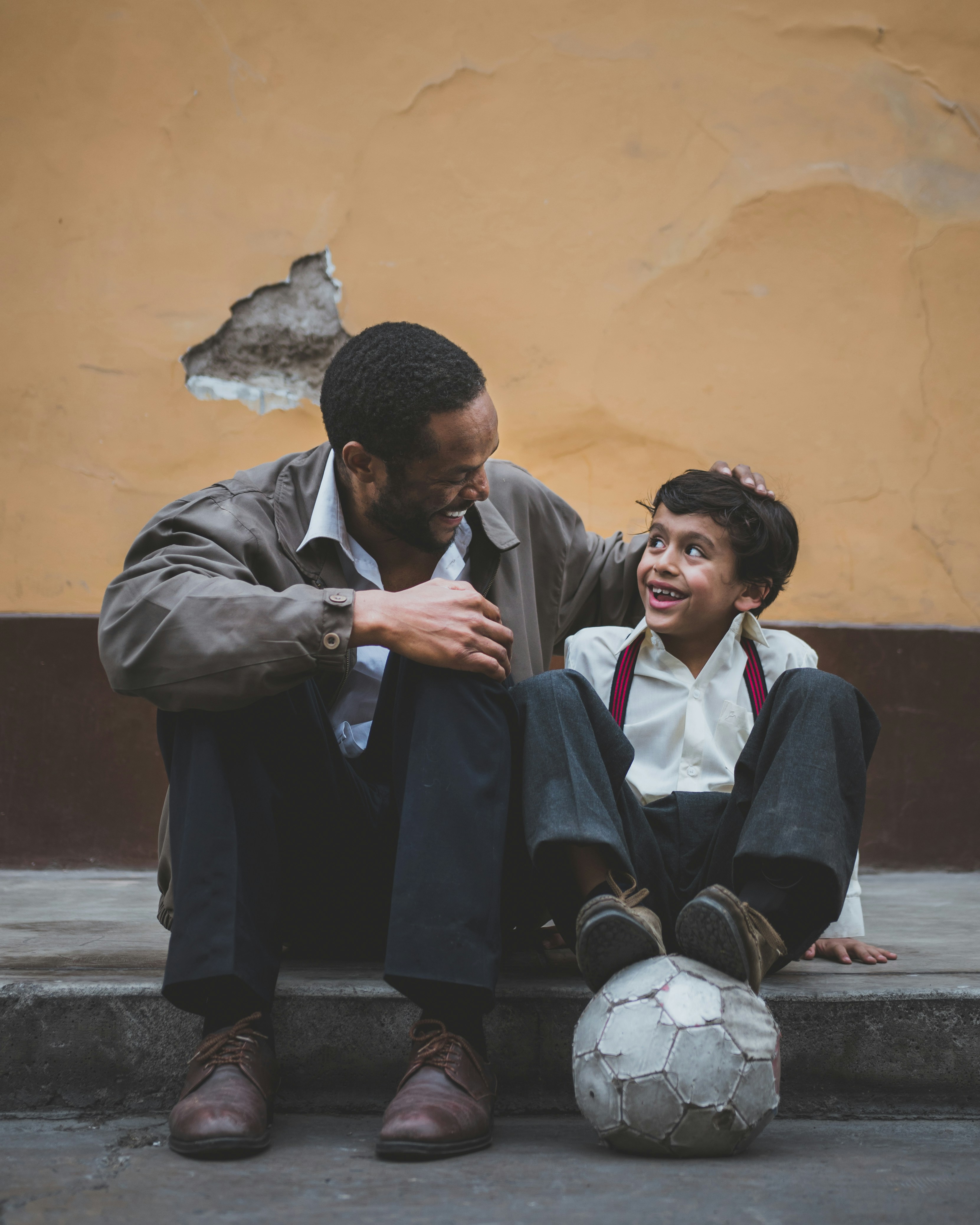 Men and child laughing